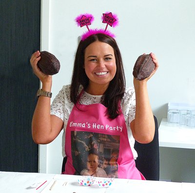 Lady holding cocoa pods at Hen party